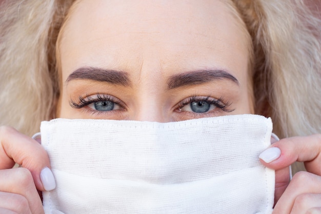 Portrait of a woman in a protective medical mask