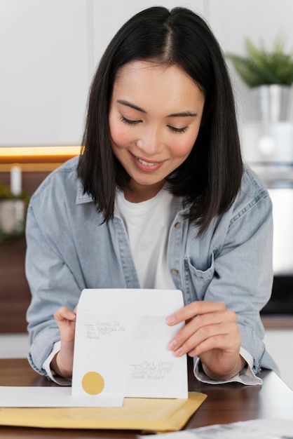 Portrait woman reading mail