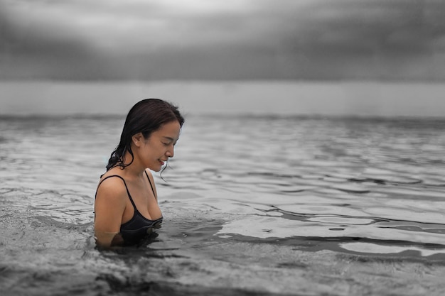 Portrait of woman relaxing in swimming pool.