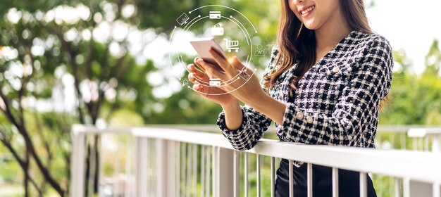 Portrait of woman relaxing using digital smartphone payment and use mobile bankingYoung girl looking at screen shopping online digital network and social mediatechnology and business