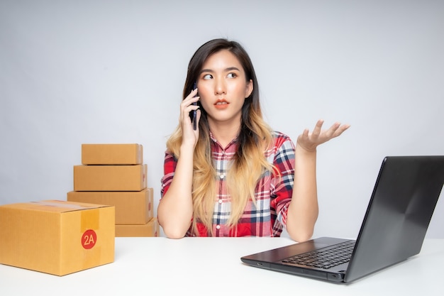 portrait woman selling shoes online