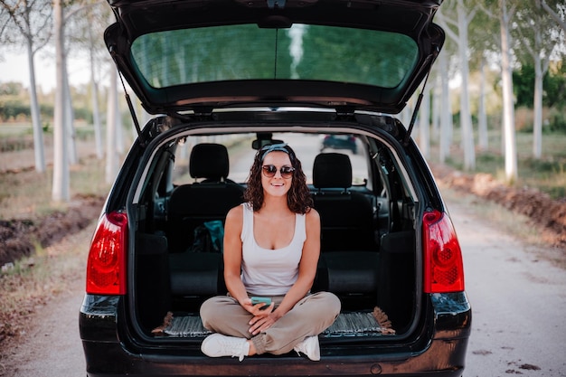 portrait of woman sitting in car