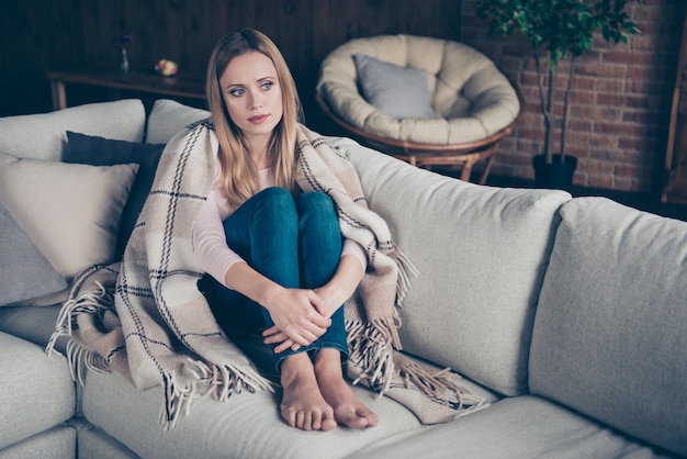 portrait woman sitting on couch