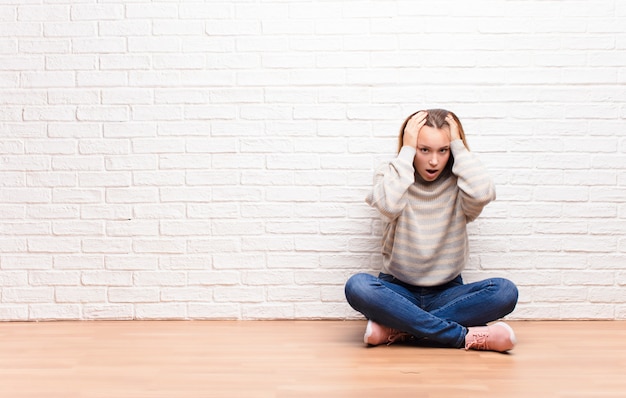 portrait of a woman sitting on a floor