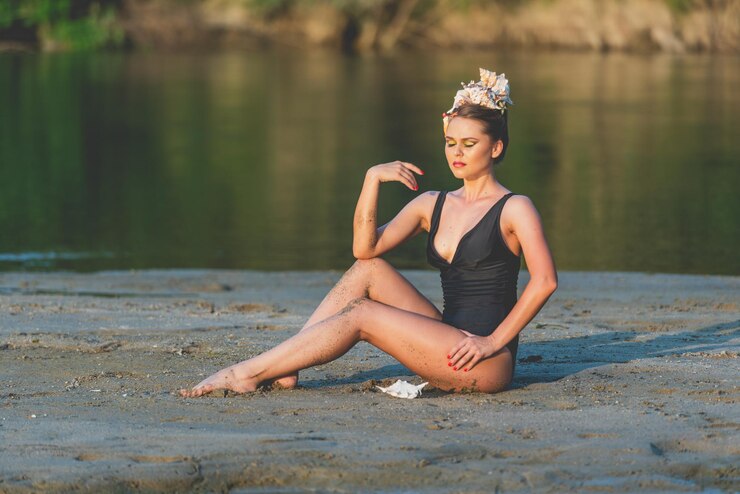 Photo portrait of woman sitting in lake