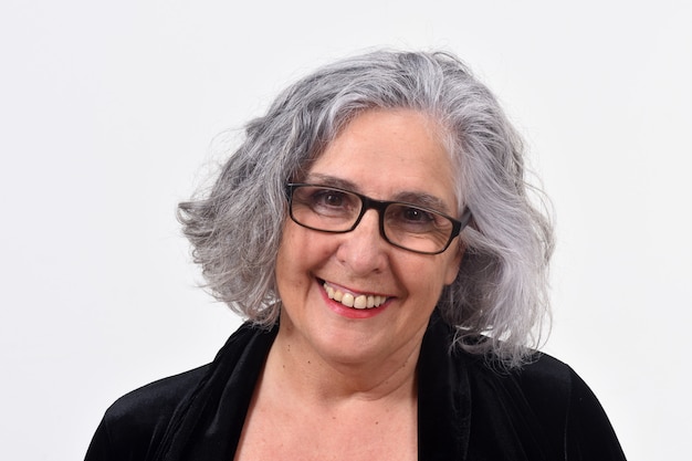 Portrait of a woman smiling on white background