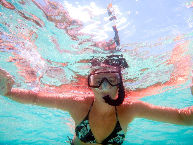 Portrait of woman snorkeling undersea