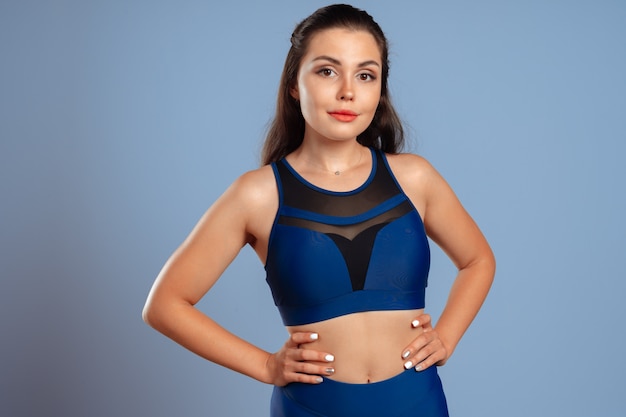 Portrait of a woman in sport clothes in gym