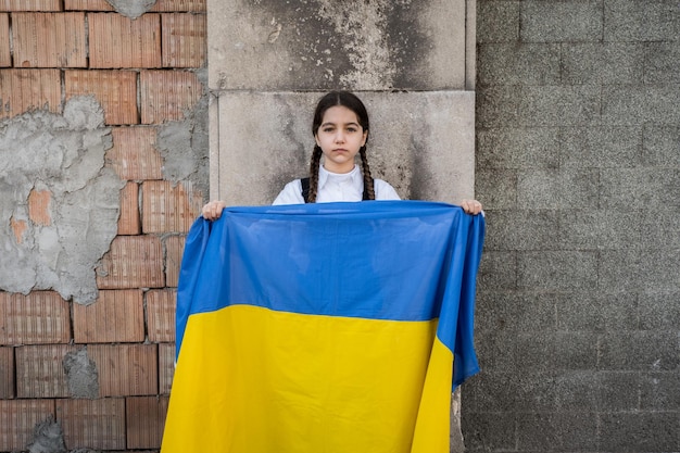 portrait of woman standing against wall