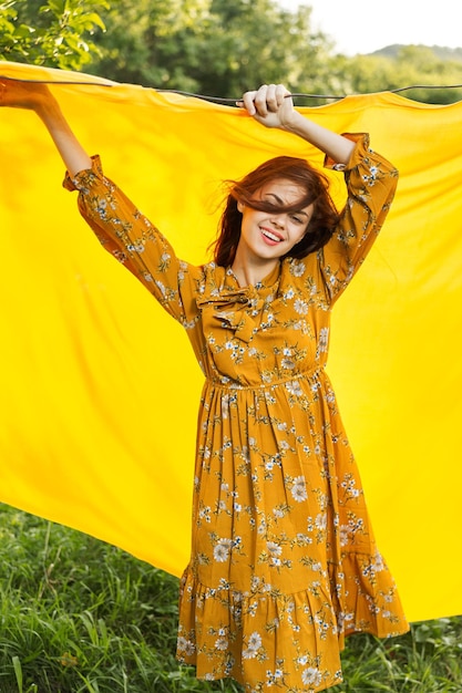 Portrait of woman standing on field