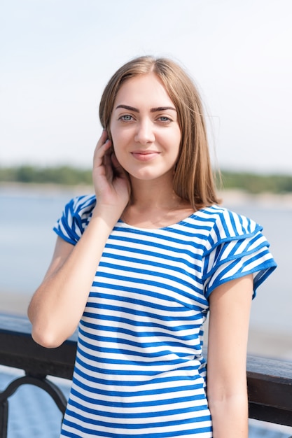 Portrait of a woman standing near the river