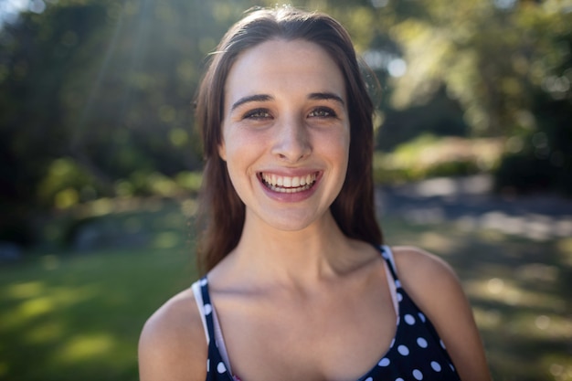 Portrait of woman standing in park