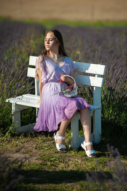 Portrait of woman on the summer field