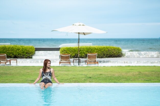 portrait woman at swimming pool, travel on holidays, girl enjoying at summer, happy time, vocation