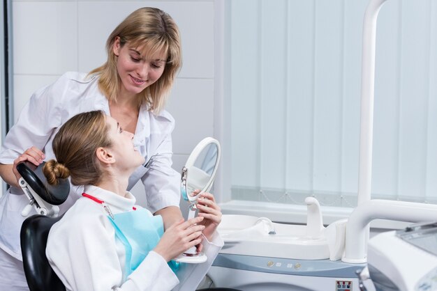 Portrait of woman talking to her dentist