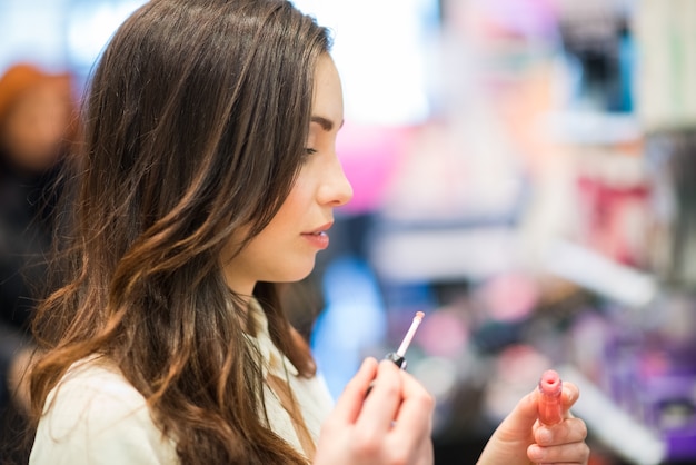 Portrait of a woman trying a product in a beauty shop