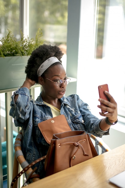 Portrait of a woman using her phone