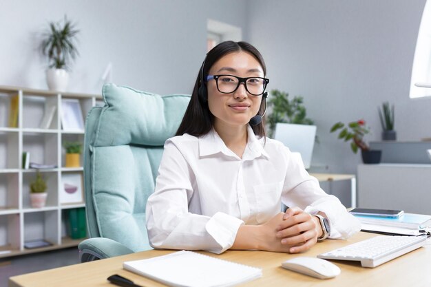 Portrait of woman using laptop at home