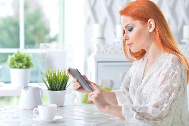 Portrait of woman using tablet computer