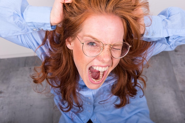 Portrait of woman wearing eyeglasses with long hair