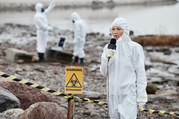 Photo portrait of woman wearing protective suit protesting toxic waste and pollution at ecological disaste...