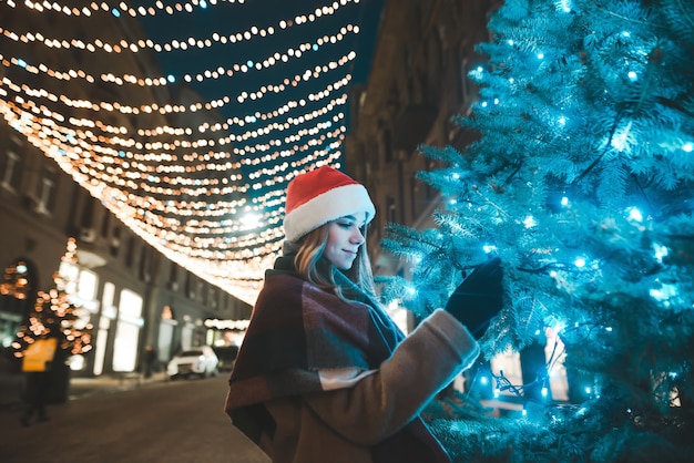 portrait woman wearing Santa hat