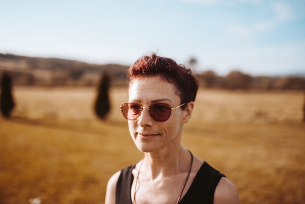 Portrait of woman wearing sunglasses standing outdoor