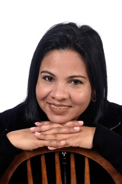 Portrait of a woman on white background,hands on chin