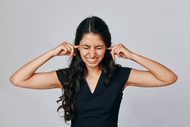 Portrait of a woman who closed her ears