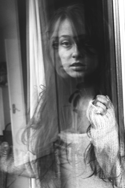 portrait of woman in window