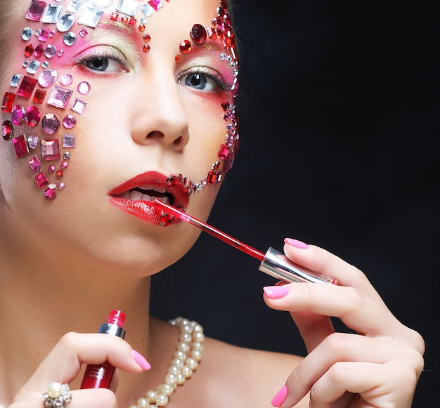 Photo portrait of woman with artistic make-up. luxury image.