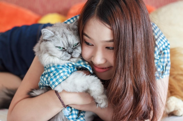 Portrait of woman with cat