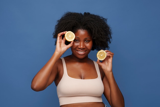 Portrait of woman with citrus for beauty