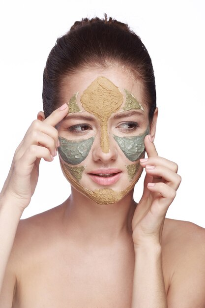 Photo portrait of a woman with a cosmetic mask on her face