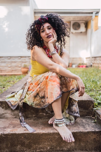 Photo portrait of a woman with curls and gypsy style.