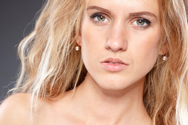 Portrait of Woman with curly hair and beautiful makeup