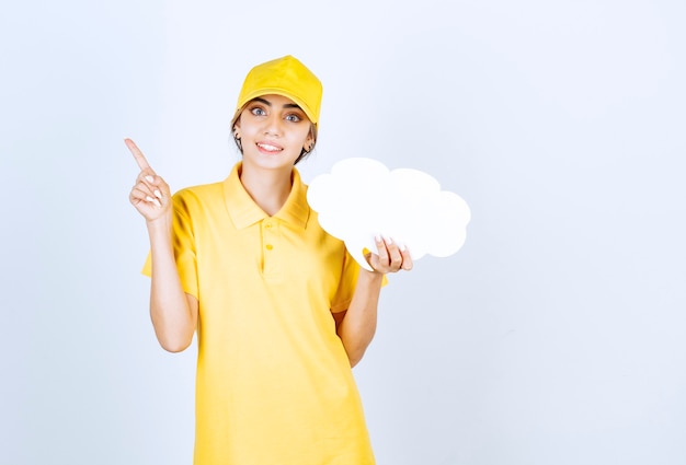 Portrait of a woman with an empty white speech bubble cloud pointing up. 