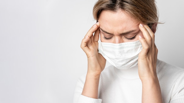 Portrait of woman with illness symptom