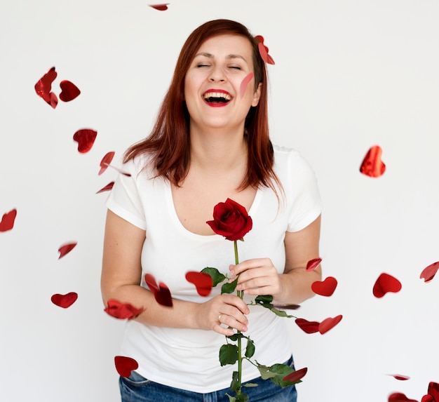 Portrait of a woman with red hair and a rose