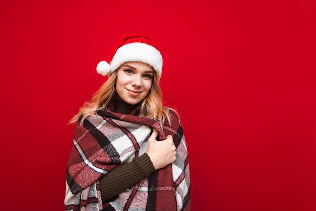 portrait woman with santa hat and blanket