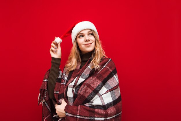 portrait woman with santa hat and blanket