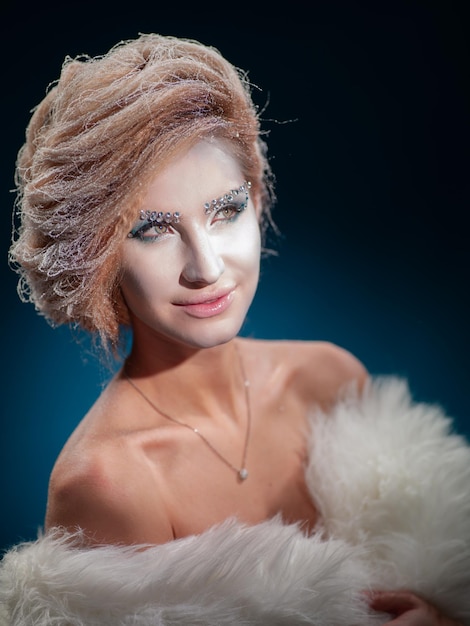 Portrait of a woman with snowy hair on a black background. Black background.