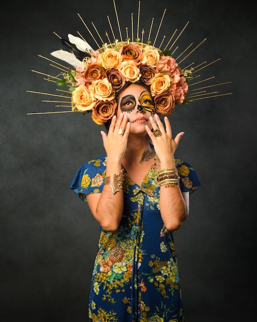 Portrait of a woman with sugar skull makeup Catrina with butterfly painted on her face