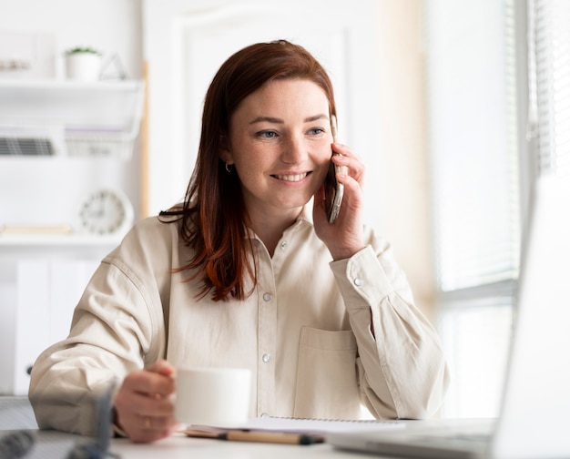 portrait woman at work having video call