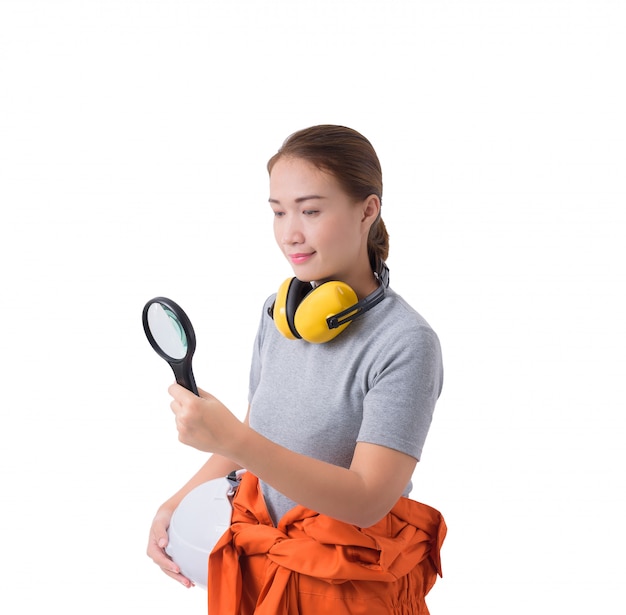 Portrait of a woman worker in Mechanic Jumpsuit hand holding Magnifying glass