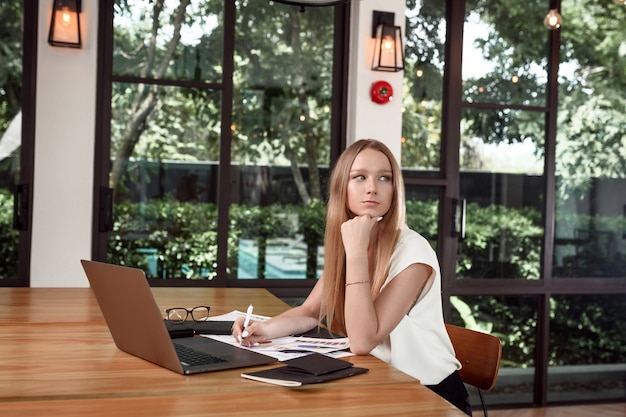 portrait woman working on a laptop