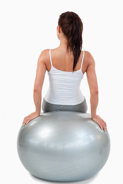 Portrait of a woman working out with a ball