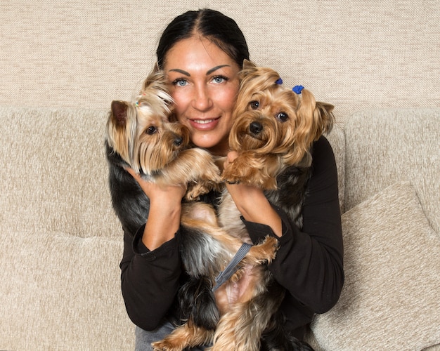 Portrait of a woman - yorkshire terrier breeder with dogs