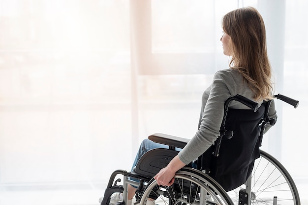 Portrait of women in wheelchair looking away