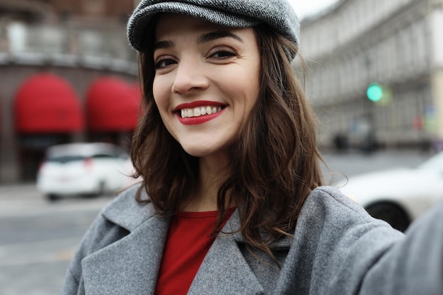 Portrait of wonderful female model with bright makeup expressing energy in good day